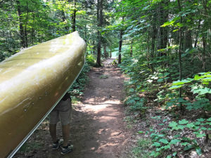 Portaging a canoe into Hambone Lake in Algonquin