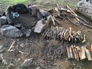 Collection of wood to prepare to cook dinner over the fire in Algonquin Park