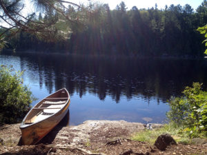 My solo canoe hanging out by the water