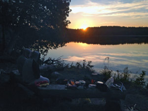 Eating breakfast while watching the sunrise on Three Mile Lake