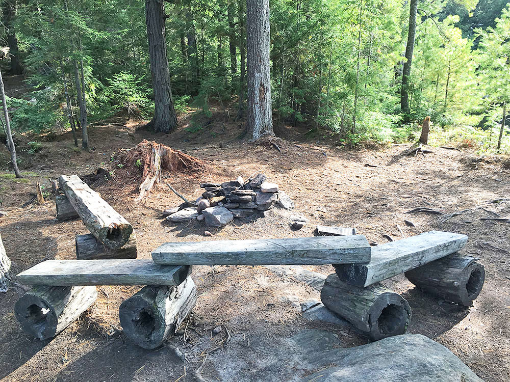 Fire pit and seating area on McIntosh Lake campsite