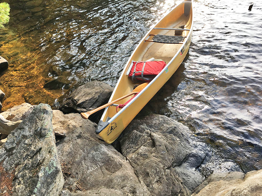 Rocky canoe landing on McIntosh Lake campsite #13
