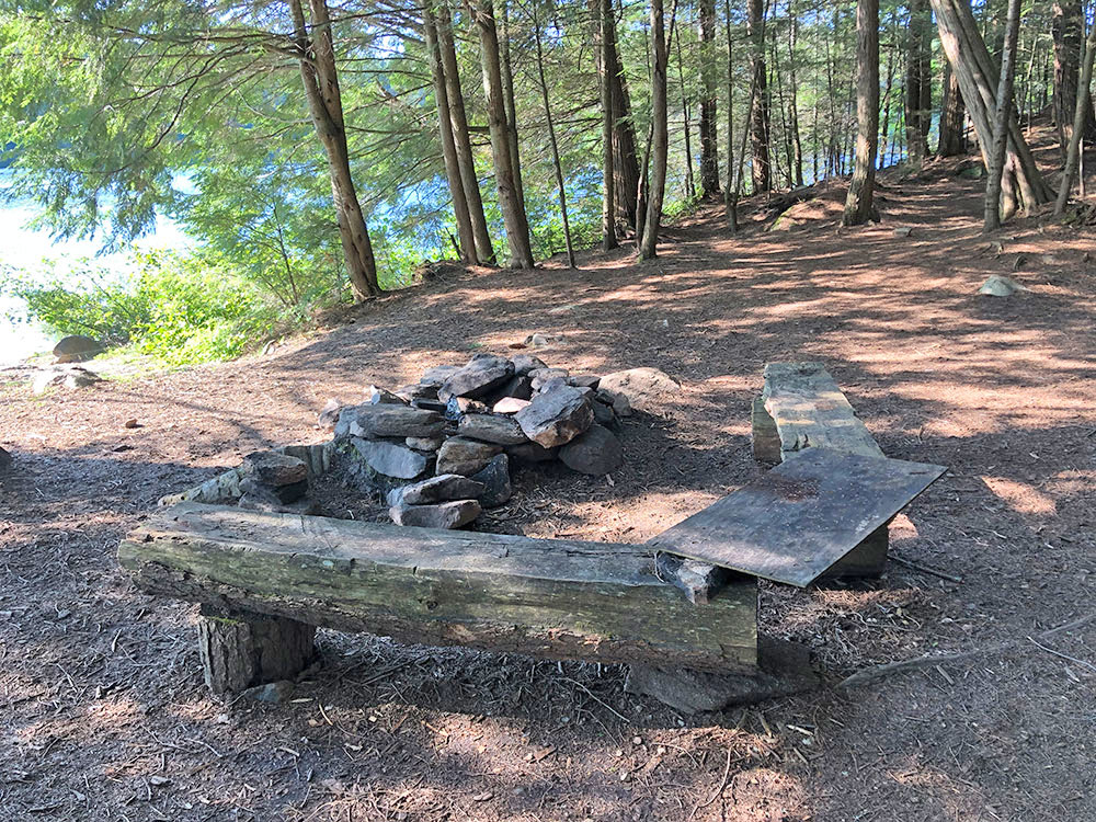 Fire pit and seating area for Lake Louisa campsite #14