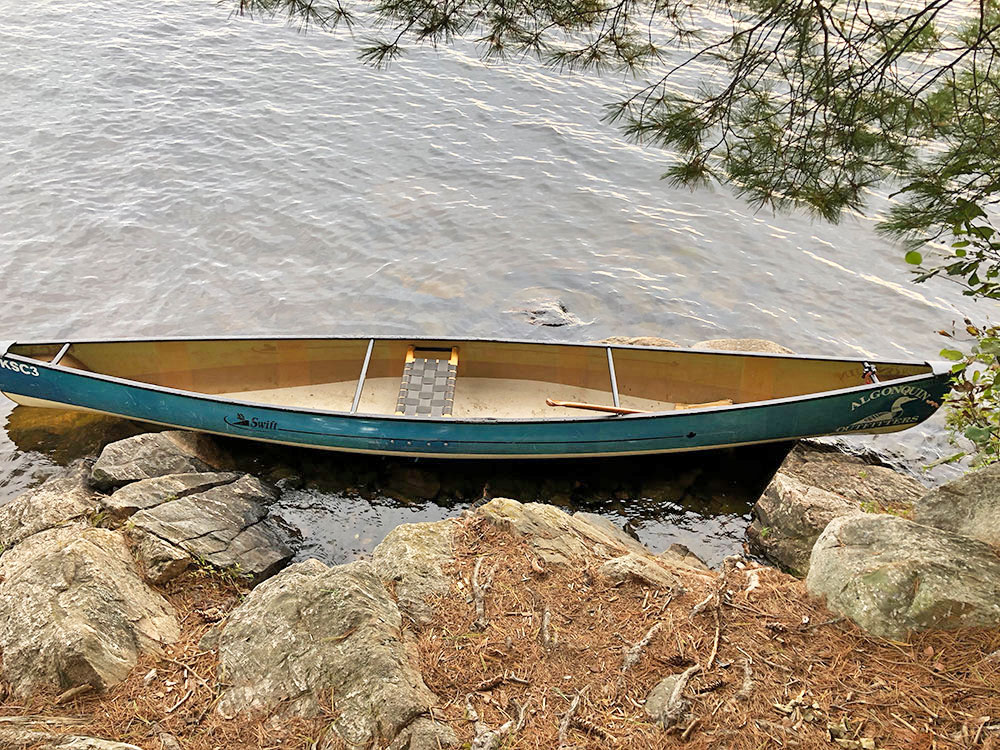 Rocky shoreline canoe landing on Big Trout Lake island campsite #11