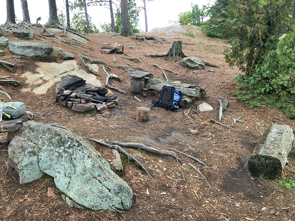 Fire pit and seating area on Burntroot Lake's Anchor Island