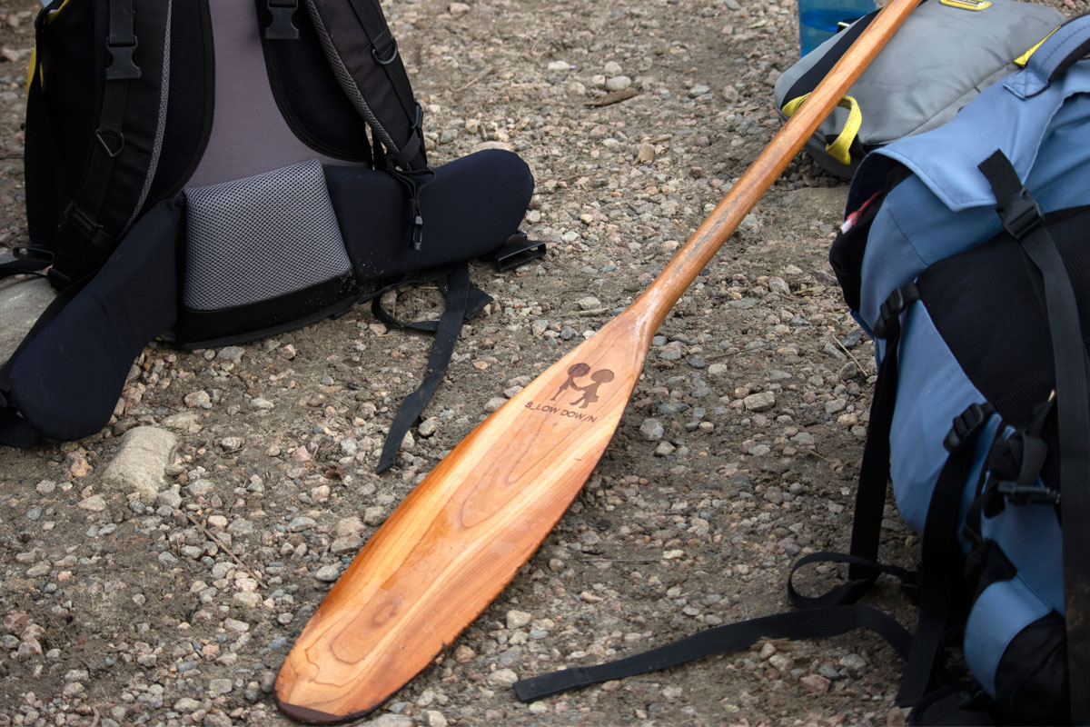Canoe paddle and gear at Ragged Lake portage Algonquin Park