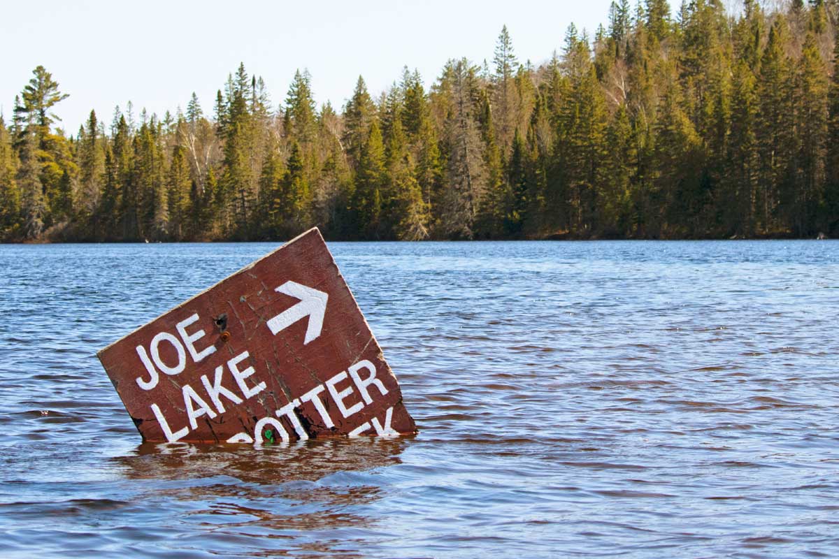 Joe Lake Potter Creek sign on Canoe Lake in Algonquin Park Ice Out April 2022