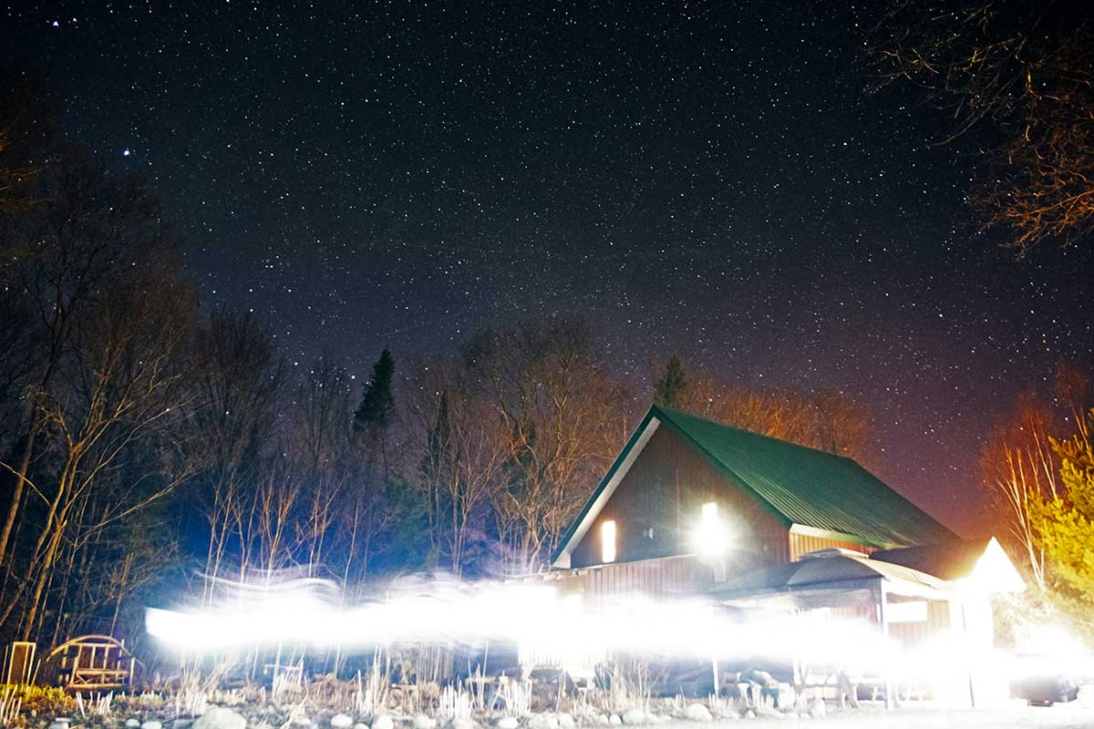 Night sky stars astrophotography at Wolf Den Nature Retreat main lodge April 2022 v2