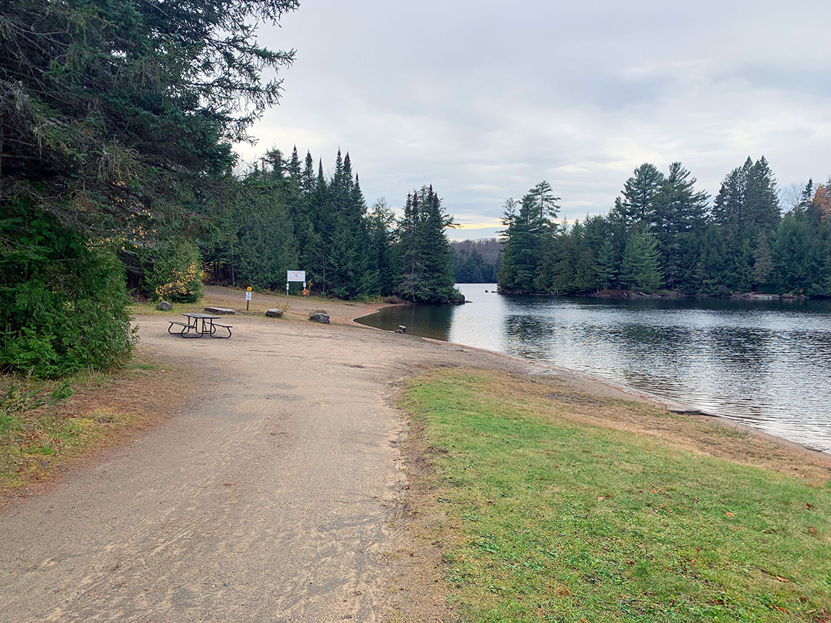Water shoreline at Tea Lake Campground in Algonquin Park, October 2023