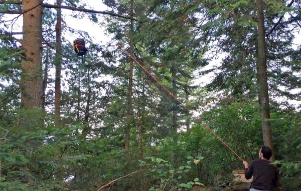 Hoisting a food pack in the interior of Algonquin Park